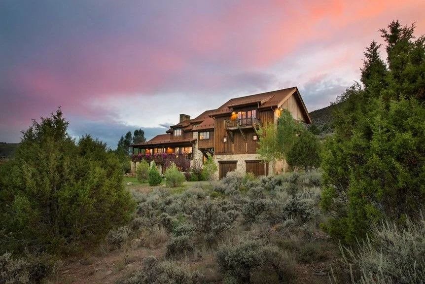 Mountain home exterior at sunset